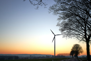 wind turbines at sunset