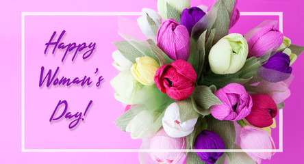 A bouquet of paper flowers and the inscription Happy Women Day. Bright bouquet of tulips and congratulations to women.
