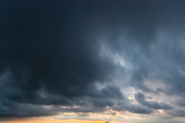 Fantastic dark thunderclouds at sunrise