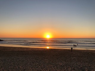 Naklejka premium Couché de soleil sur la plage de Costa da Caparica, Portugal 