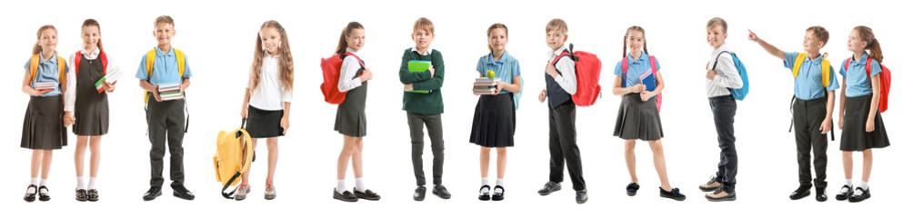 Collage with cute little pupils in different school uniforms on white background - obrazy, fototapety, plakaty