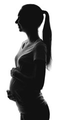 Fototapeta premium Silhouette of beautiful pregnant woman on white background