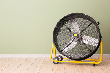Electric fan near color wall