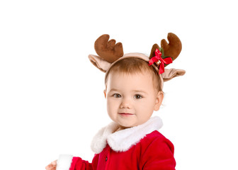 Cute little baby in Santa Claus costume and deer horns on white background