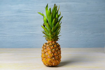 Fresh ripe pineapple on wooden table
