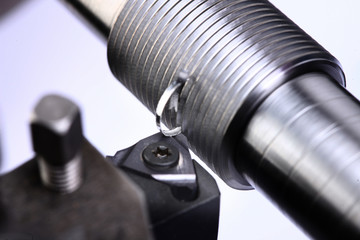 close up of metal cutting on lathe