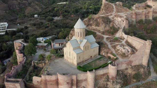 View of the ancient Narikala fortress at sunny day drone footage.