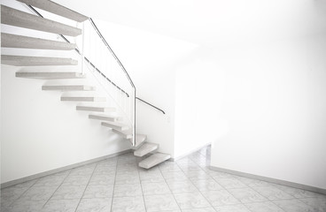 twisted staircase in clean white building leading up to second floor