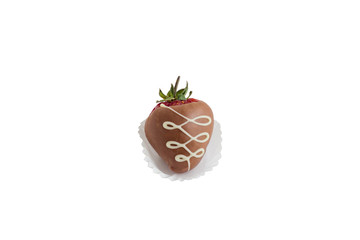 big red strawberry with a green tail with brown milk chocolate with a pattern and in a paper basket isolated on white background