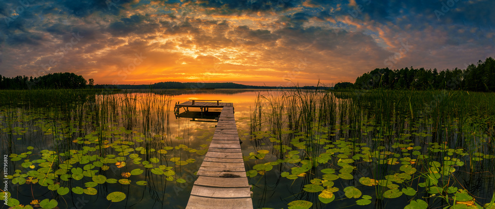 Wall mural panorama of beautiful sunrise over lake