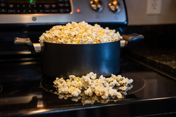 homemade popcorn overflowing in pot