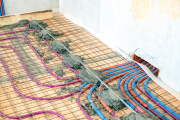 Installation of Underfloor heating, heated with antifreeze. Underfloor heating with heat transfer fluid. Cement screed with metal reinforcement.