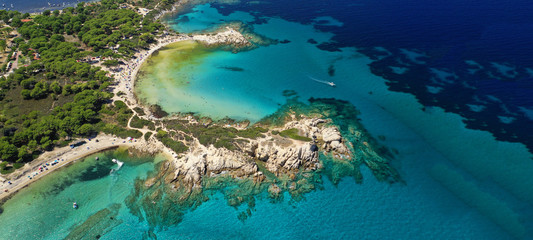 Fototapeta na wymiar Aerial drone ultra wide photo of beautiful turquoise bay and beach of Kavourotripes with rocky seascape in Sithonia Peninsula, Halkidiki, Greece