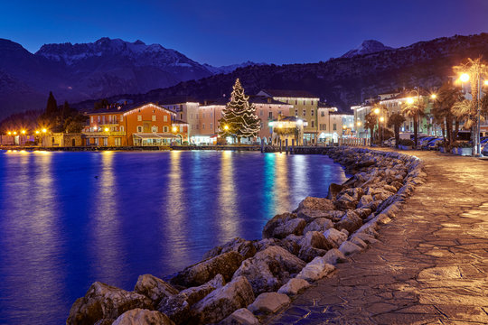 Christmas lights adorning the city center and Torbole Street, View of the beautiful Torbole town by night,Trento,Italy