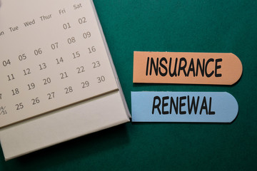 Insurance Renewal write on stick note isolated on Office Desk