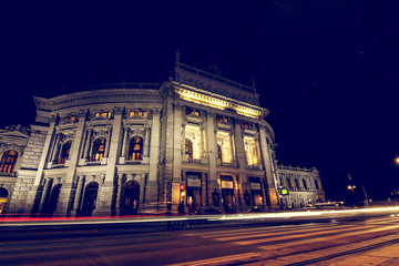 Fototapeta na wymiar Vienna, Wien, Austria / 24th January 2019: Hofburg Theater by night, with cars light trails