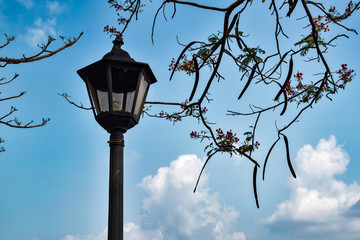 old street lamp on the background of blue sky