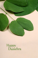 Indian Festival Dussehra, showing golden leaf . Greeting card.