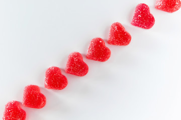 Diagonal of red marmalade on a white background.