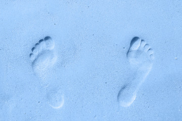 Footprint on the sand. Color of the year 2020 Classic Blue