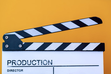 movie clapper isolated on yellow background