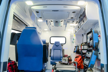 Inside an ambulance car with medical equipment for helping patients before delivery to the hospital.