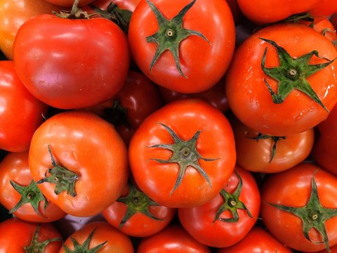 fresh pile of tomtato in traditional market