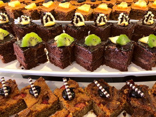 Lots of different beautiful chocolate brownies at a buffet in a restaurant. Random photo in a cafe....