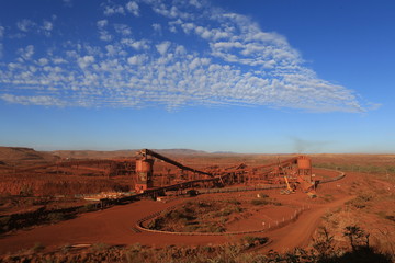 Beautiful morning sun over mining pit operation Pilbara region with blue sky at the background,...