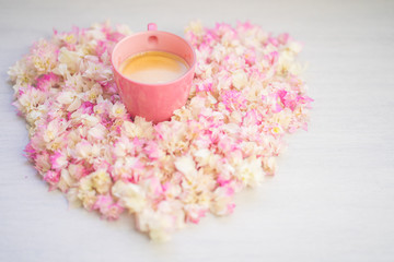 Obraz na płótnie Canvas Cup coffee on pink Bougainvillea