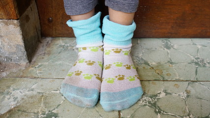 Closeup of little girls feet in socks