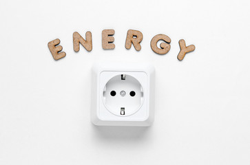 Power socket with the word Energy on white background. Top view