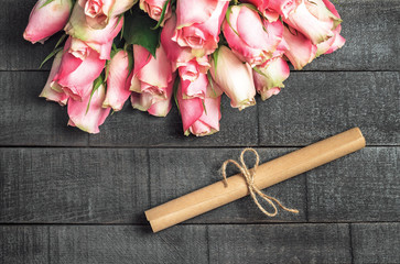 Bouquet of roses and letter scroll - 311828227