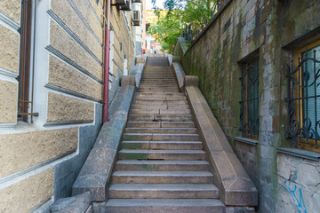 Old stone staircase between two old buildings