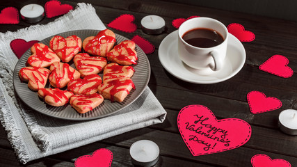 cookie-hearts, paper hearts, candles, boxes with presents and a Cup of black coffee, congratulation with Valentine's day. - 311828252