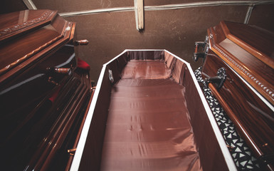 Wooden coffins in the dark room.