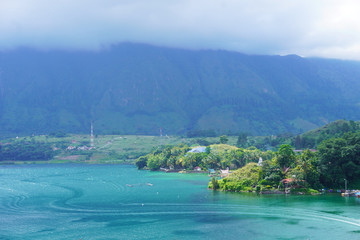 Samosir Island, is a large volcanic island in Lake Toba