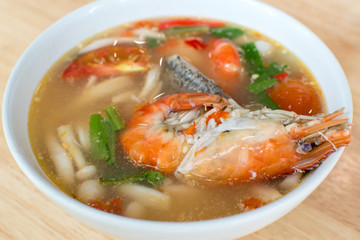 Thai hot and sour shrimp soup (Tom Yum Kung) with mashroom and grouper fish.Thai local food.