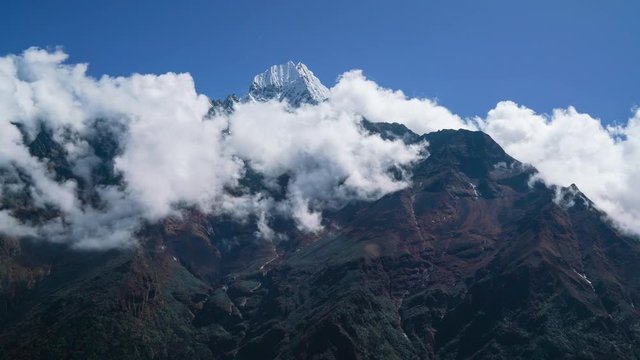 4K timelapse of clouds over Thamserku mountain in Khumbu region, in East Nepal