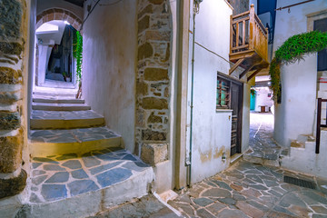 Narrow neighborhood streets and buildings at the old Chora, Naxos island, Greece.