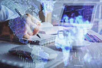 Financial chart drawn over hands taking notes background. Concept of research. Double exposure