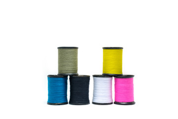 Colorful of cotton sewing thread isolated on white background. Concept for tailor equipment ,Needlework ,Garment shop.