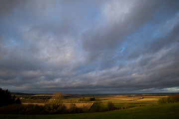 Rain clouds over farmland fields in the rural county of Hampshire