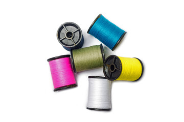 Colorful of cotton sewing thread isolated on white background. Concept for tailor equipment ,Needlework ,Garment shop.