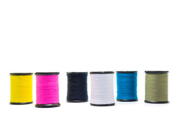 Colorful of cotton sewing thread isolated on white background. Concept for tailor equipment ,Needlework ,Garment shop.