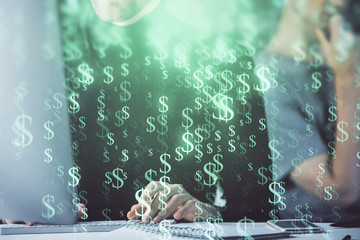 Fototapeta premium Forex graph with businessman typing on computer in office on background. Concept of analysis. Double exposure.