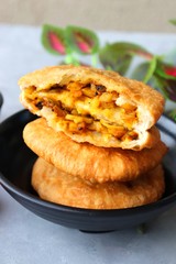 Shegaon or Rajasthani Kachori served with tamarind Chutney and sev. Kachori or Kachodi is a spicy fried snack from India stuffed with spicy potatoes and onion mixture.