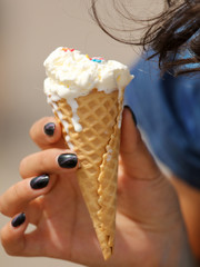 Girl eats an ice cream cone