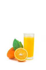 A cup of orange juice and cut orange on  white background.