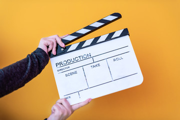 movie clapper isolated on yellow background